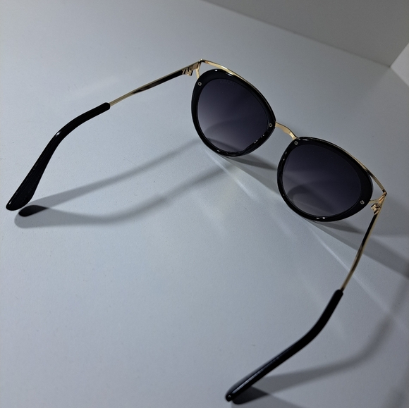 Prada Black Frame Sunglasses with Gold Temple Accents - Picture 6 of 12